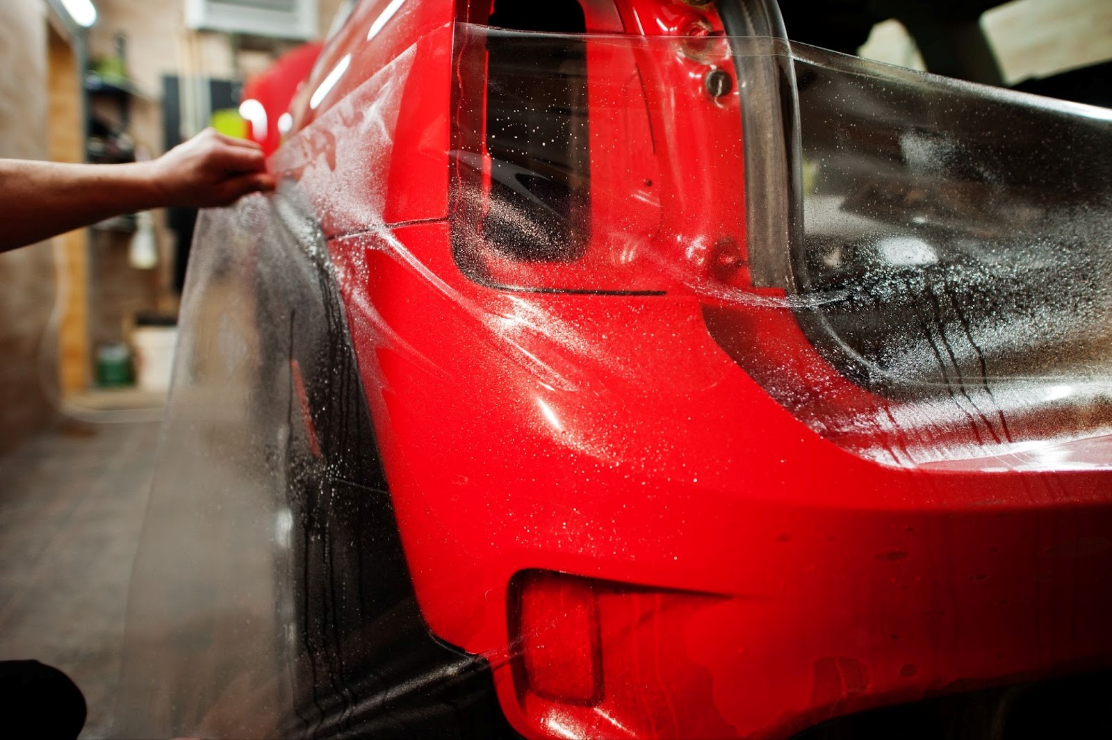 STEK Paint Protection Film install in progress on a luxury vehicle hood at SSF Detail