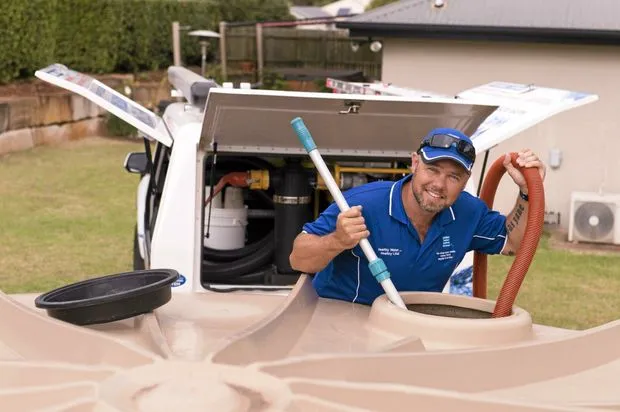 Pristine Water Systems technician cleaning a residential rainwater tank