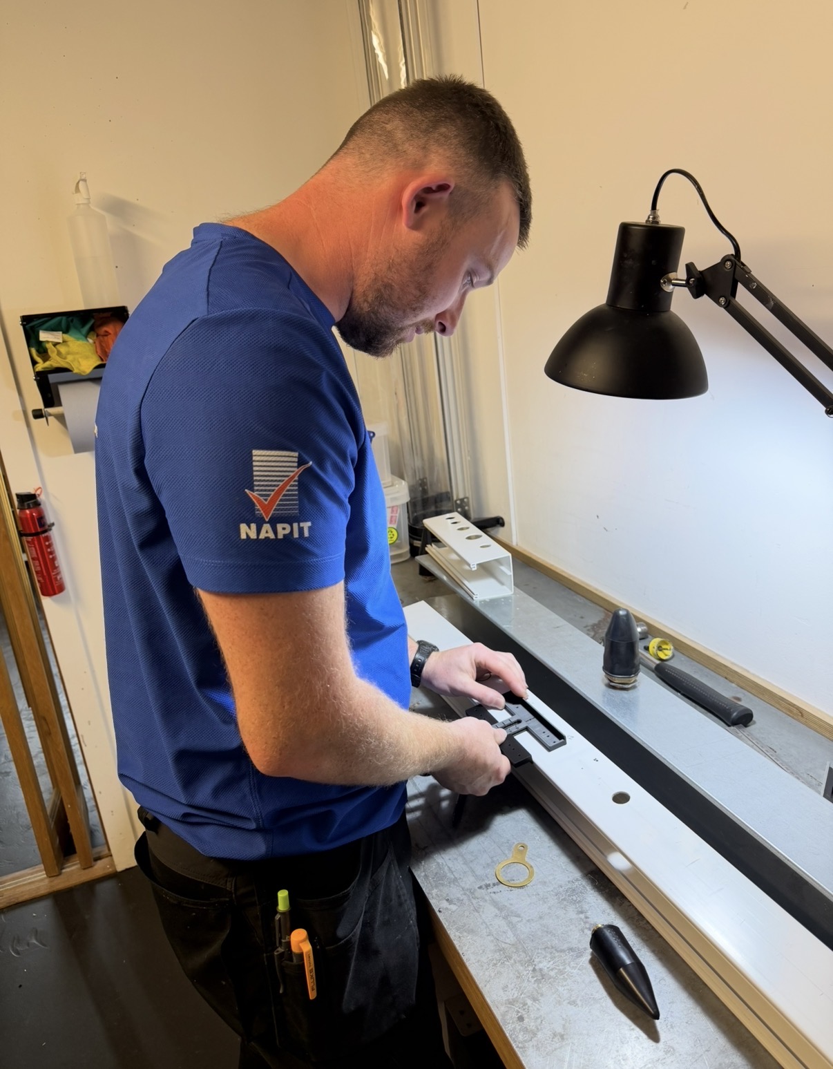 AdjustaGland founder — commercial electrician using the tool in his workshop